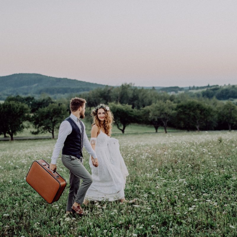 beautiful-bride-and-groom-at-sunset-in-green-natur-P8PLWCQ.jpg