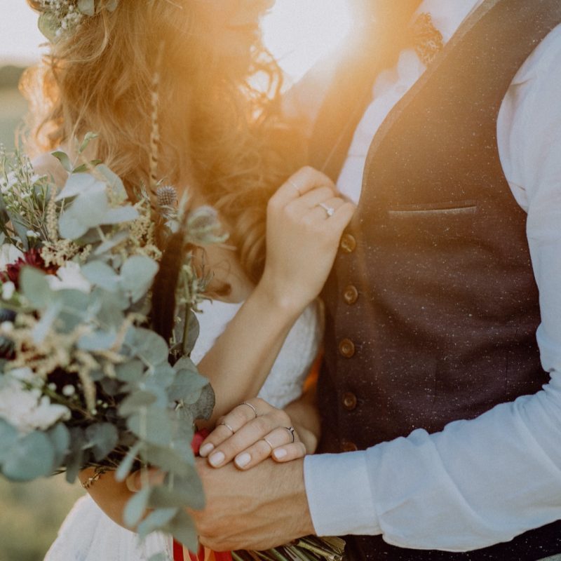 beautiful-bride-and-groom-at-sunset-in-green-natur-PSP7T5E.jpg