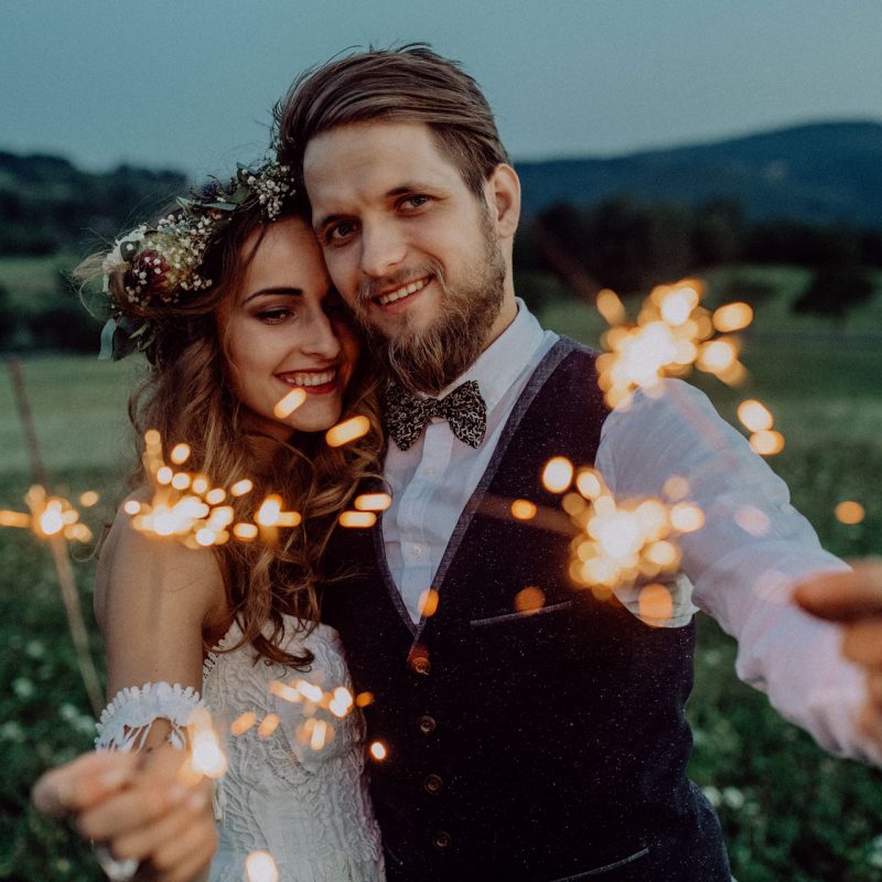 beautiful-bride-and-groom-on-a-meadow-in-the-eveni-P8TUGS9-gallery.jpg